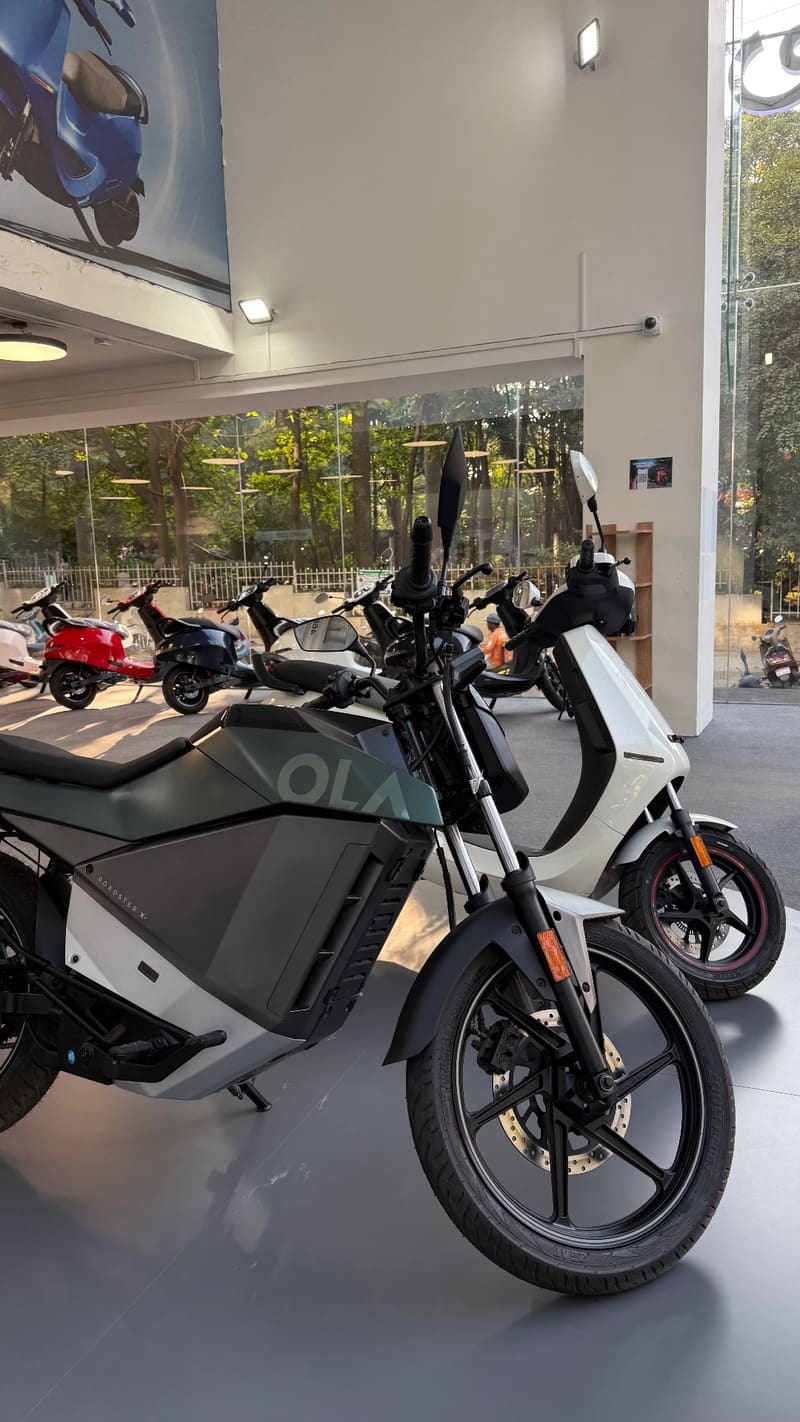 Ola Roadster X and electric vehicles displayed in showroom